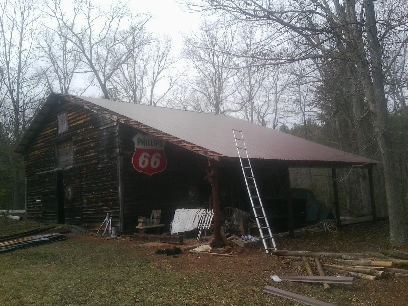 New metal roof on an open sided timber barn with a vintage sign in Westfield